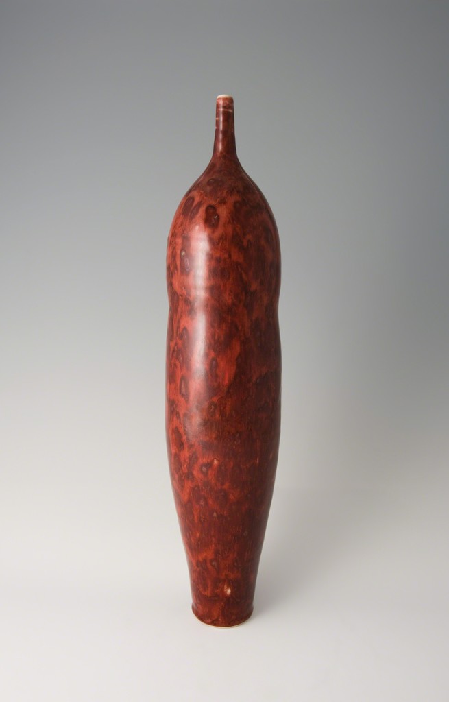 Tall narrow vase, textured copper red glaze